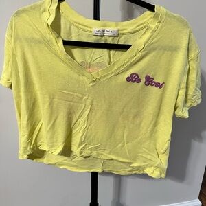 We The Free Light Yellow V-Neck Top with Purple Text